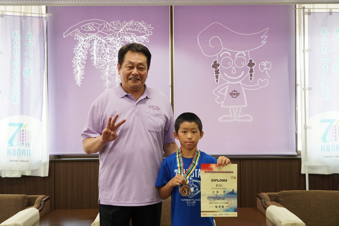安藤優選手と澤田市長の写真
